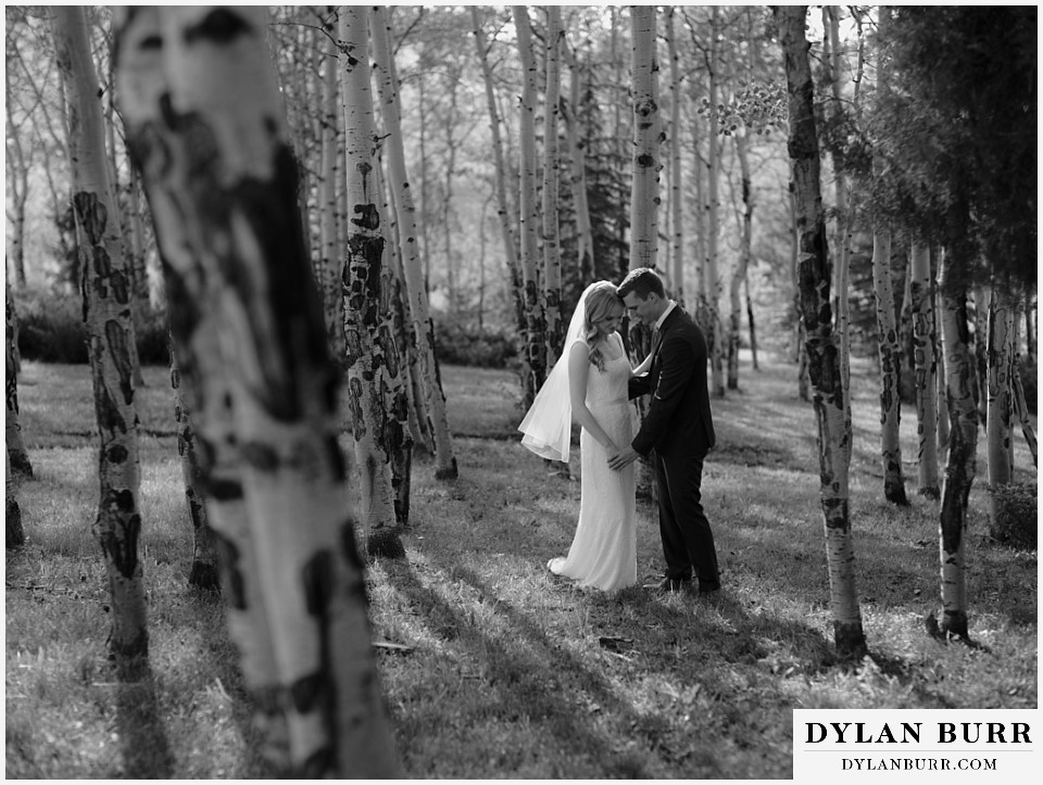 personal mountain home colorado wedding black and white photo of couple dancing in the aspen trees