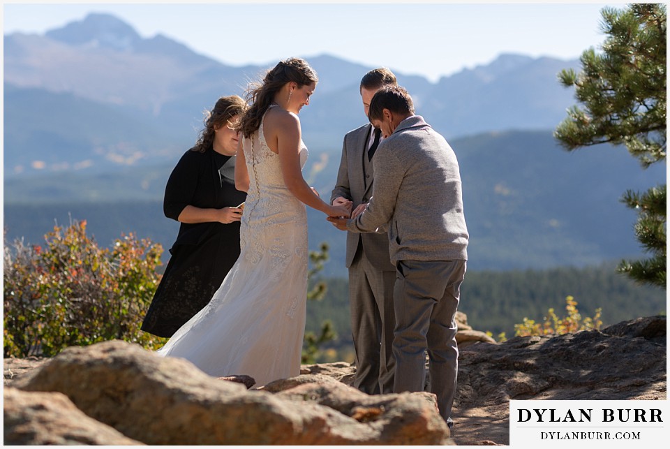 rocky mountain national park elopement wedding father brings in rings