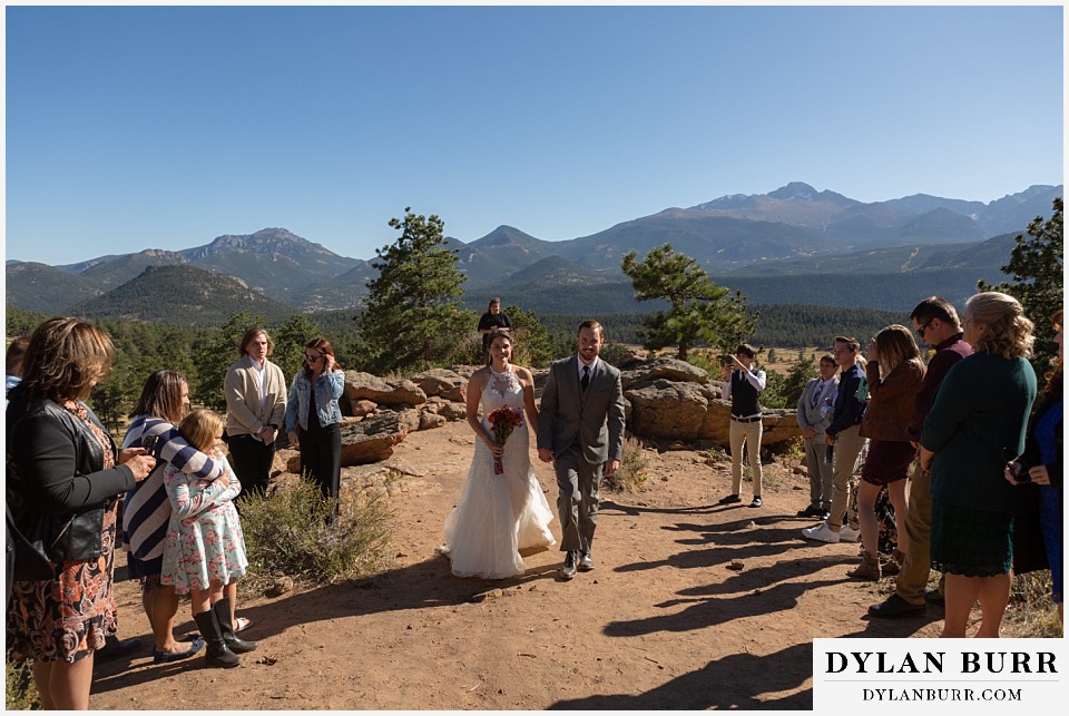 rocky mountain national park elopement wedding wife husband walking out of ceremony