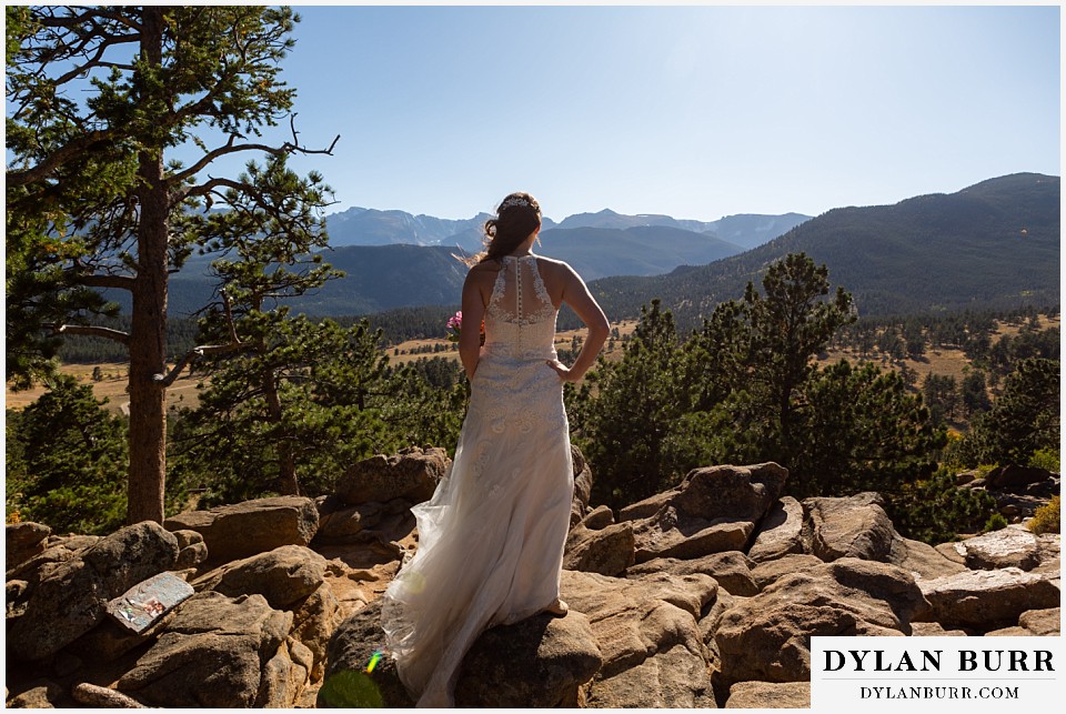rocky mountain national park elopement wedding bride looks out over valley
