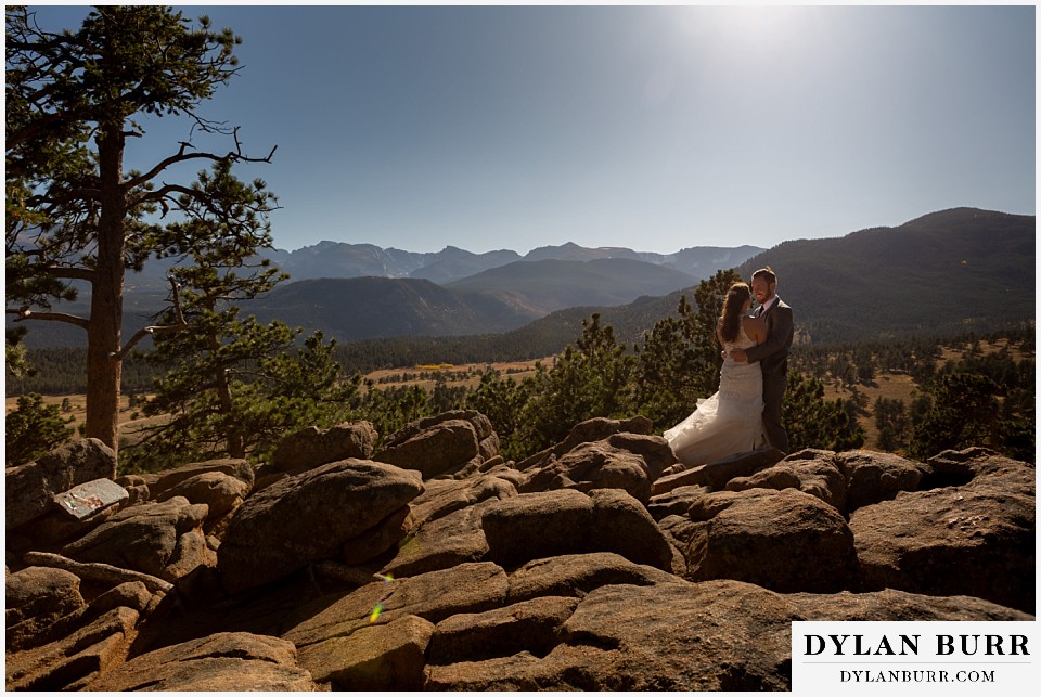 rocky mountain national park elopement wedding bride and groom on rocky ledge