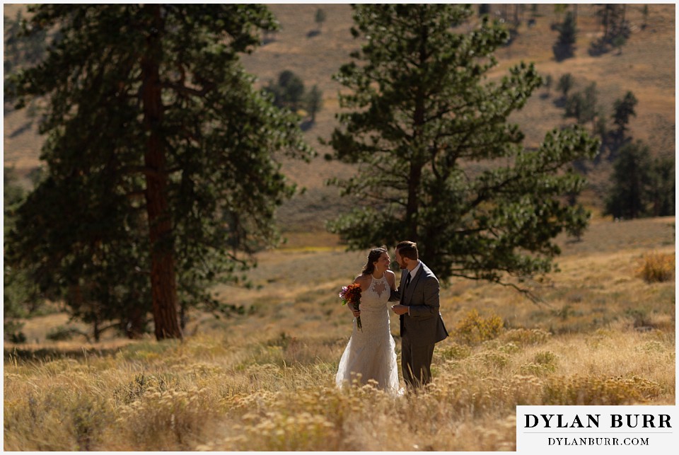 rocky mountain national park elopement wedding bride and groom laughing together