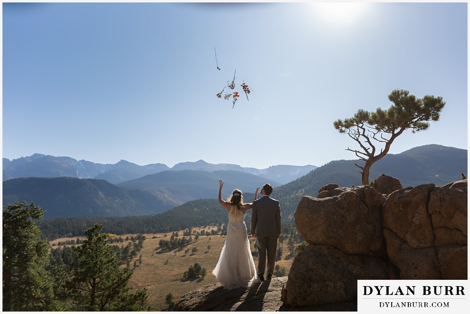 rocky mountain national park elopement wedding bride tossing bouquet into air
