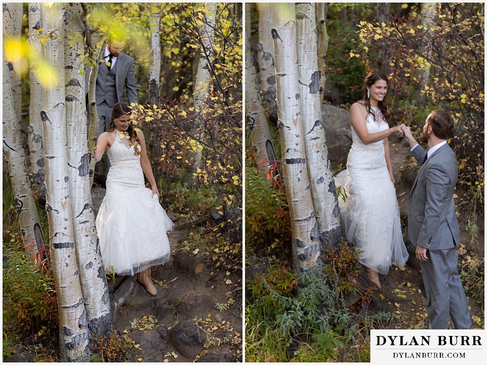 rocky mountain national park elopement wedding groom helping bride down in forest