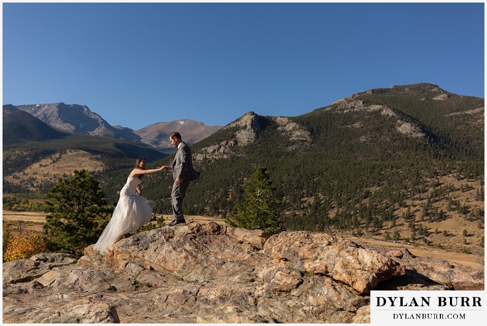 rocky mountain national park elopement wedding bride and groom walking up mountain