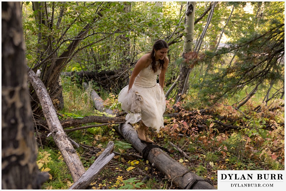 rocky mountain national park elopement wedding bride balancing on log