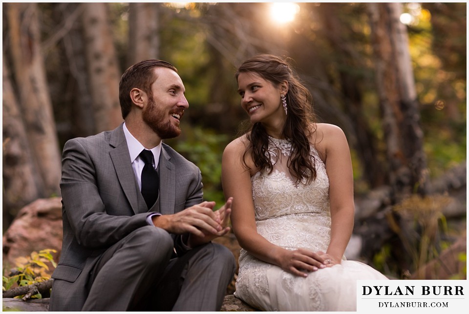 rocky mountain national park elopement wedding couple telling jokes to eachother