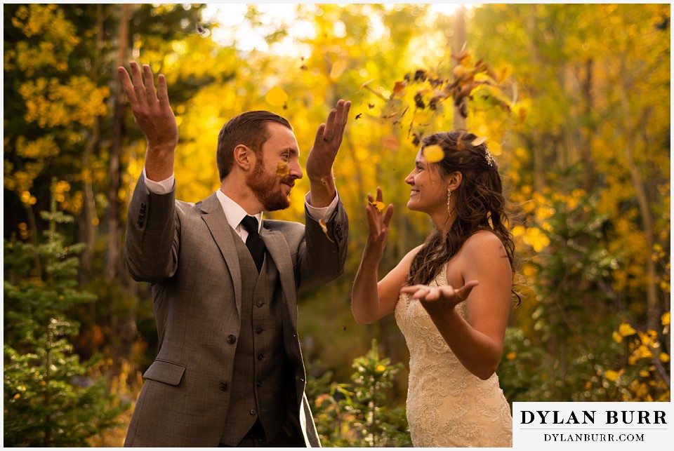 rocky mountain national park elopement wedding throwing up fall colored leaves
