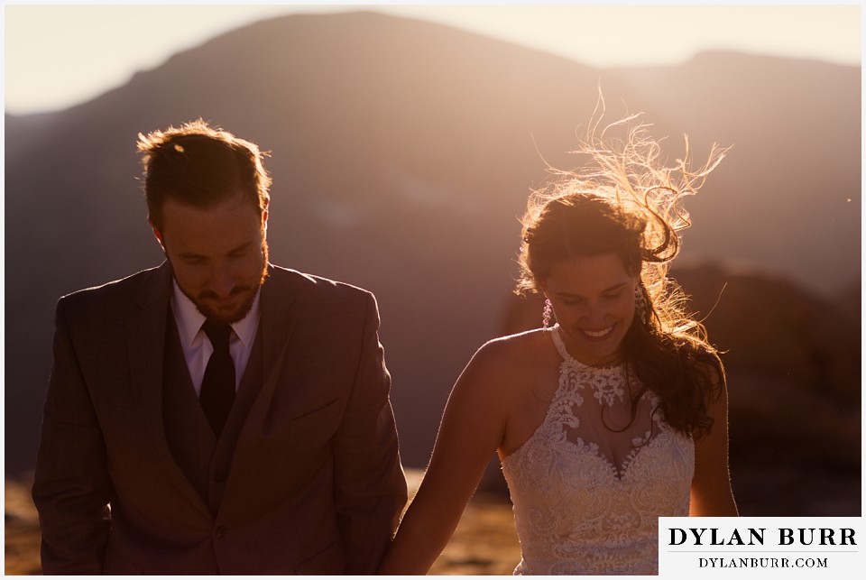 rocky mountain national park elopement wedding couple walking together in wind