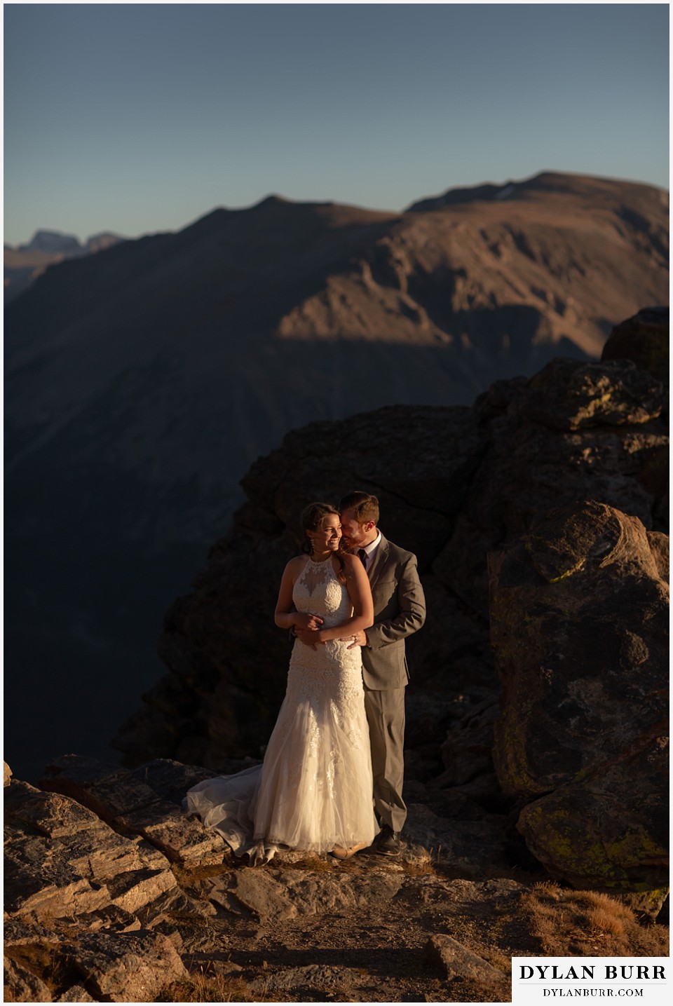 rocky mountain national park elopement wedding newlyweds nuzzling in close at sunset