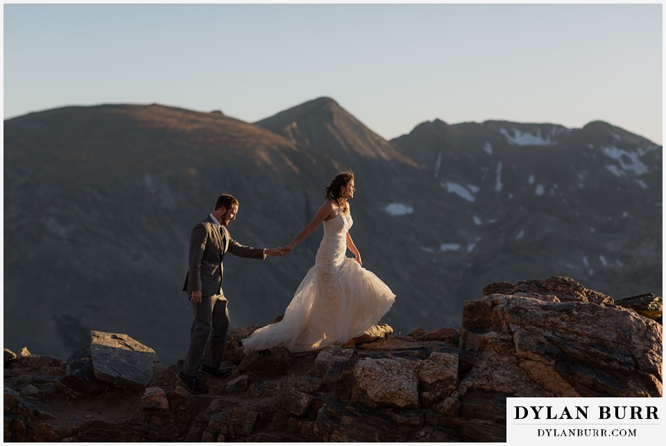 rocky mountain national park elopement wedding bride and groom hiking together