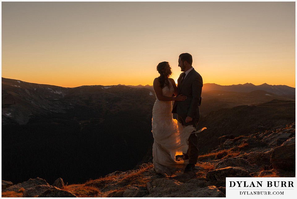 rocky mountain national park elopement wedding bride and groom at sunset surrounded by light