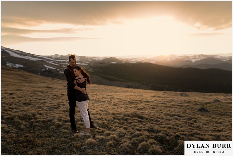 rocky mountain engagement session in colorado huge mountain view at sunset