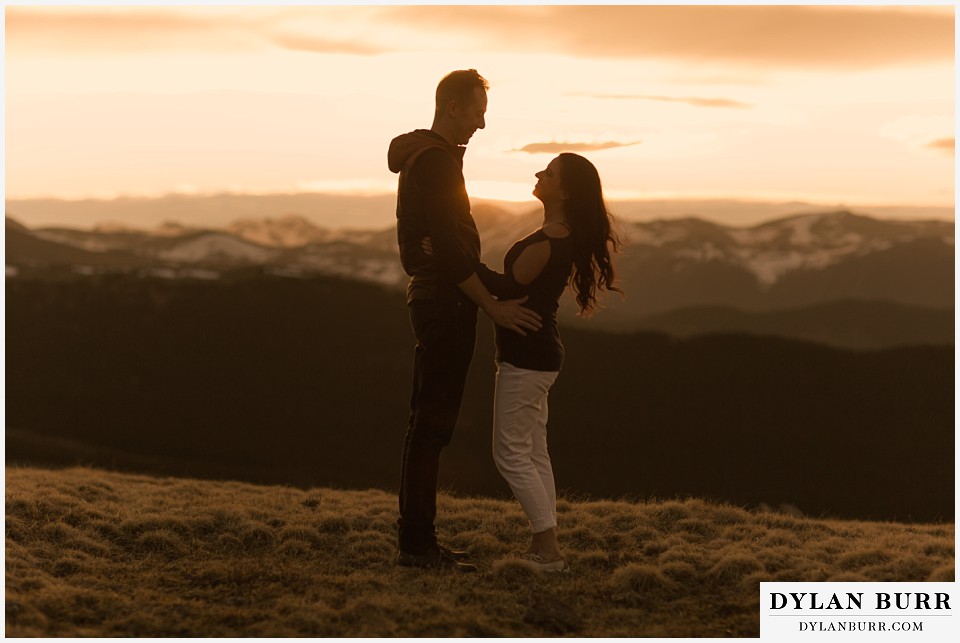 rocky mountain engagement session in colorado sunset silhouette