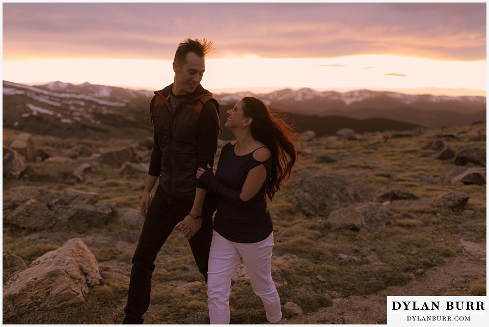 rocky mountain engagement session in colorado on top of the mountain at sunset