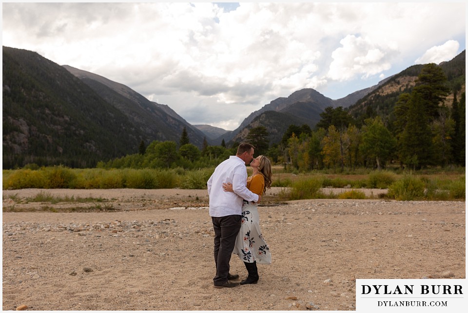 rocky mountain national park elopement wedding bride and groom kissing in mountain valley