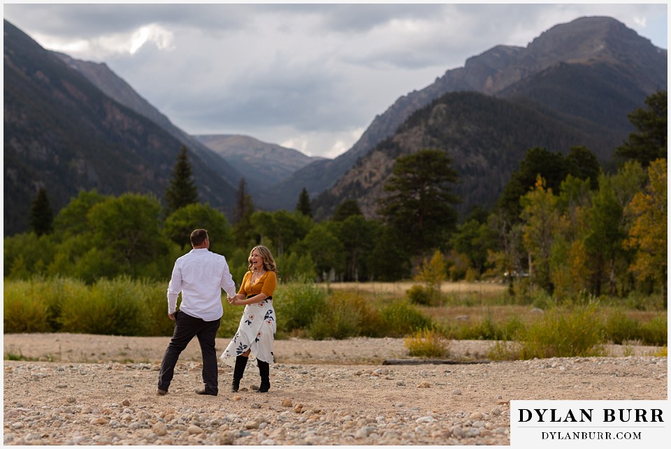 rocky mountain national park elopement wedding bride and groom laughing together in mountain valley