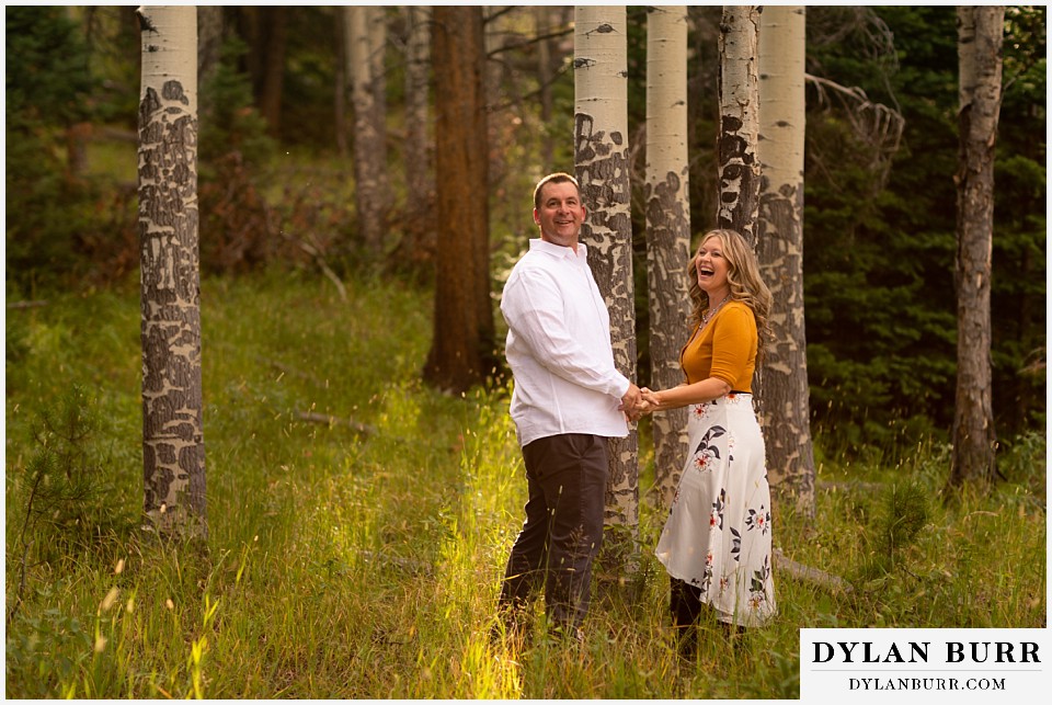 rocky mountain national park elopement wedding couple looking back at photographer laughing