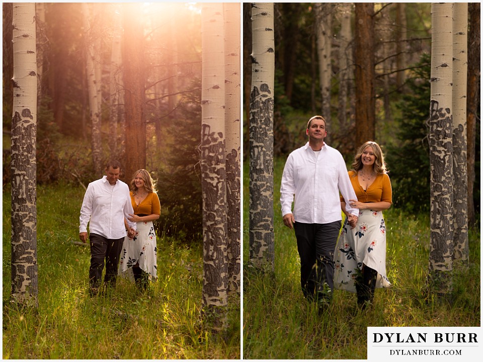 rocky mountain national park elopement wedding bride and groom walking in sunlight in aspen trees