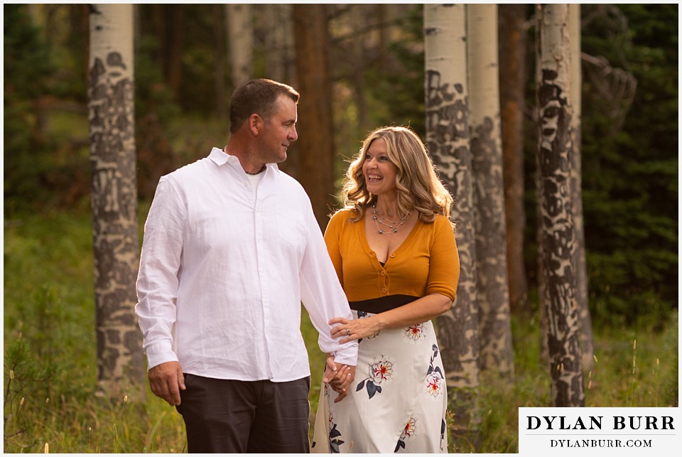 rocky mountain national park elopement wedding brides hair glowing while walking with groom