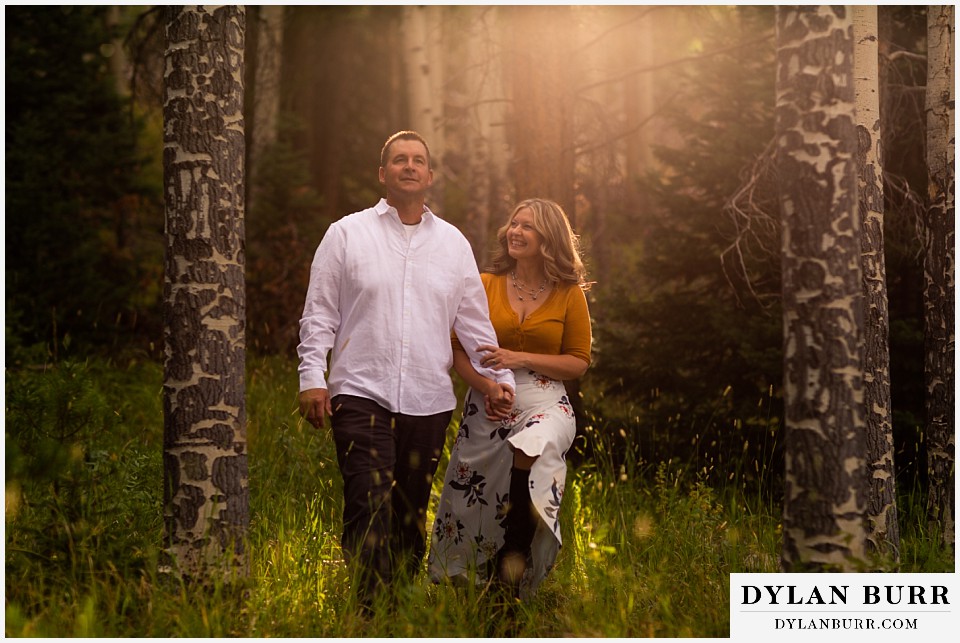 rocky mountain national park elopement wedding happy newlyweds in sunset forest