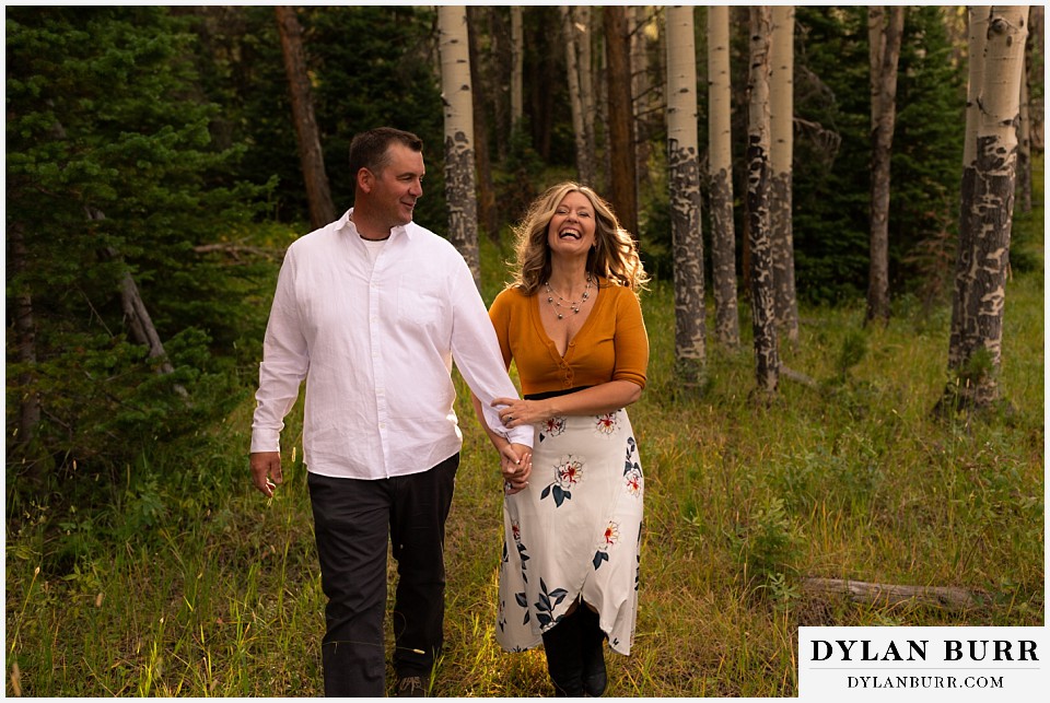 rocky mountain national park elopement wedding couple laughing together in forest