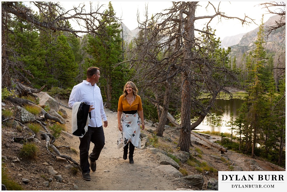 rocky mountain national park elopement wedding couple walking in forest together