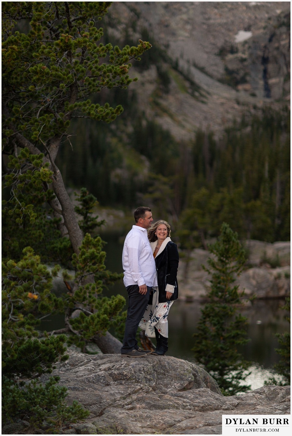 rocky mountain national park elopement wedding bride and groom laughing in mountains