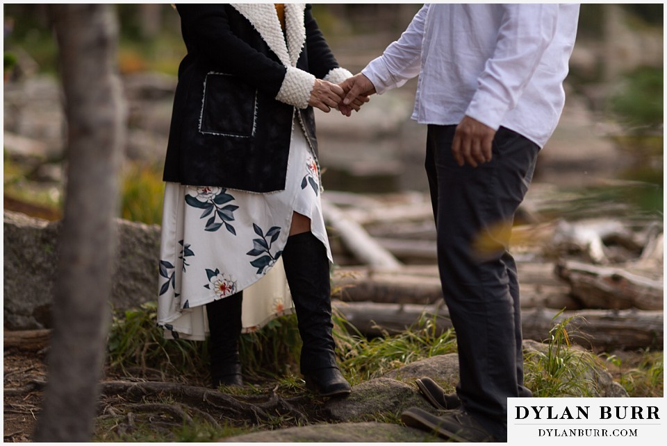 rocky mountain national park elopement wedding couple holding hands in mountains