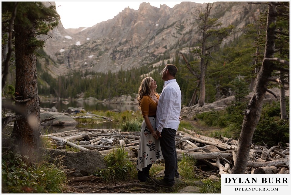 rocky mountain national park elopement wedding newlwed couple hiking in mountains by a alpine lake