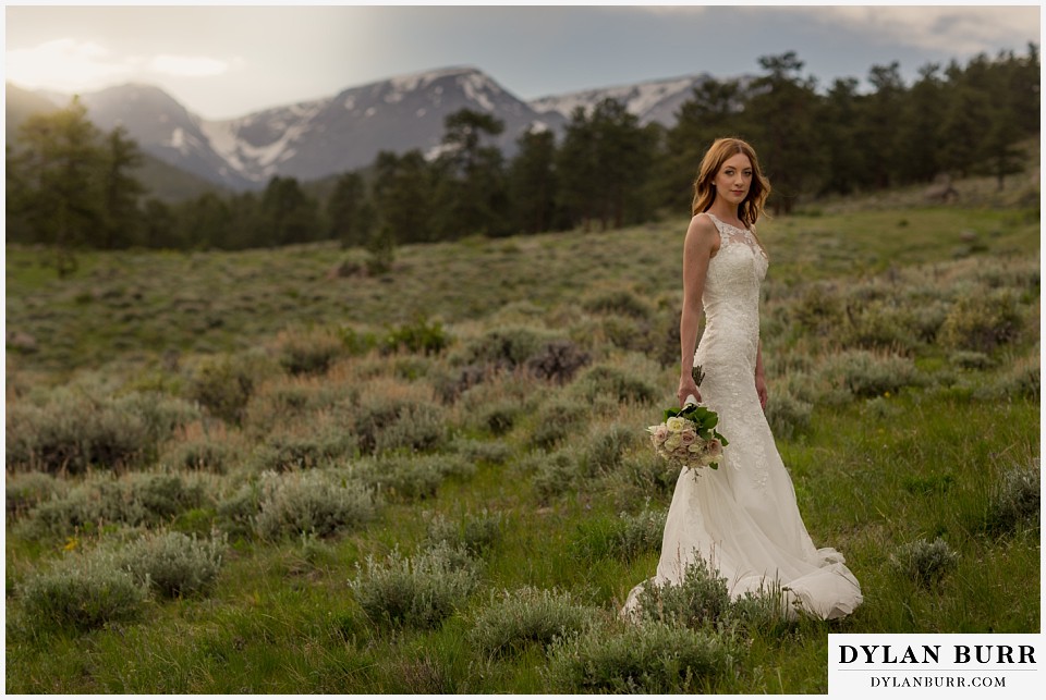 rocky mountain national park elopement wedding rmnp bride in mountains with sunset glow