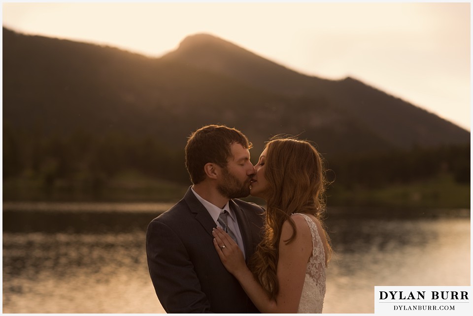 rocky mountain national park elopement wedding rmnp kissing at the lake