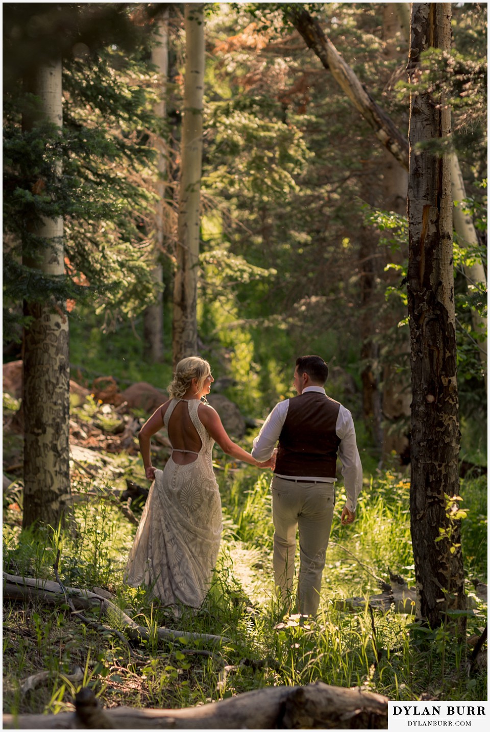 rocky mountain national park wedding elopement bride and groom adventuring in the forest