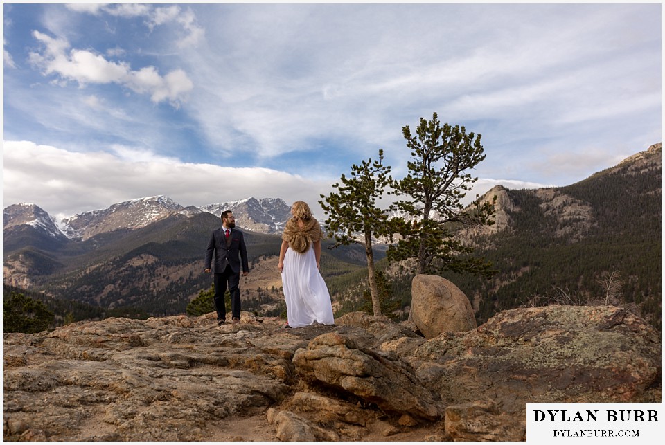 rocky mountain national park wedding elopement bride and groom with snow capped mountains in background