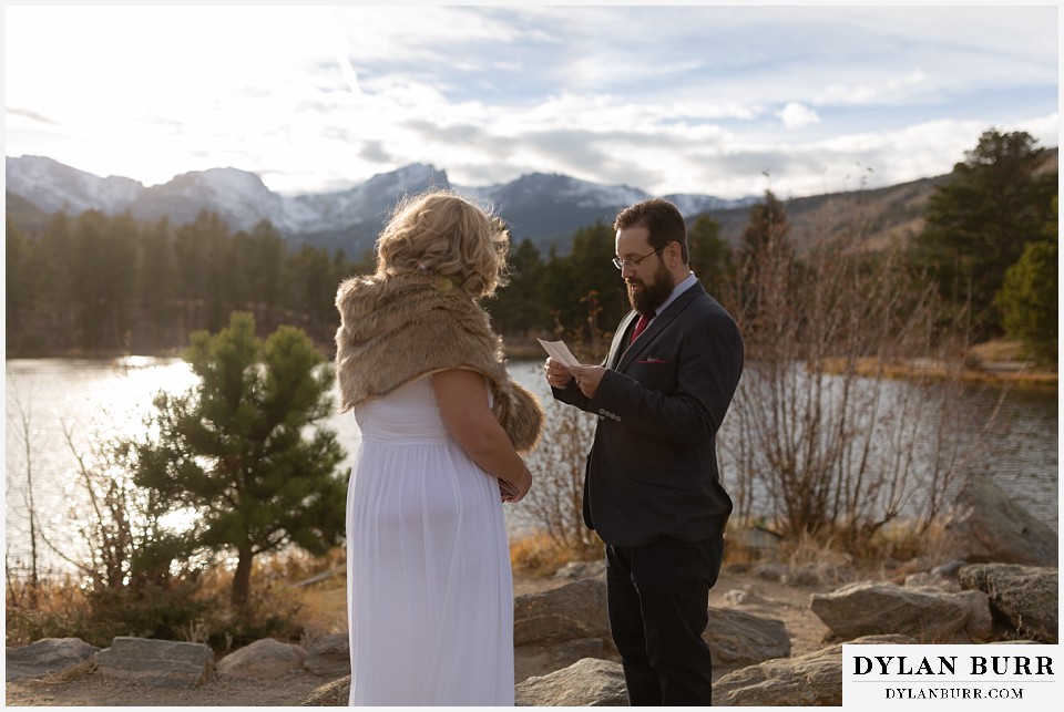 rocky mountain national park wedding elopement groom reading his wedding vows to his wife