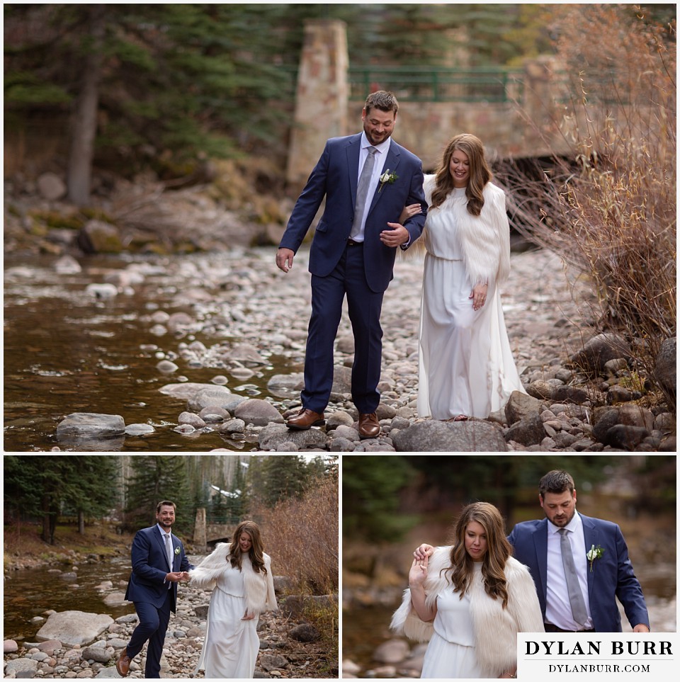 sonnenalp vail wedding bride and groom walking together along creek on rocks