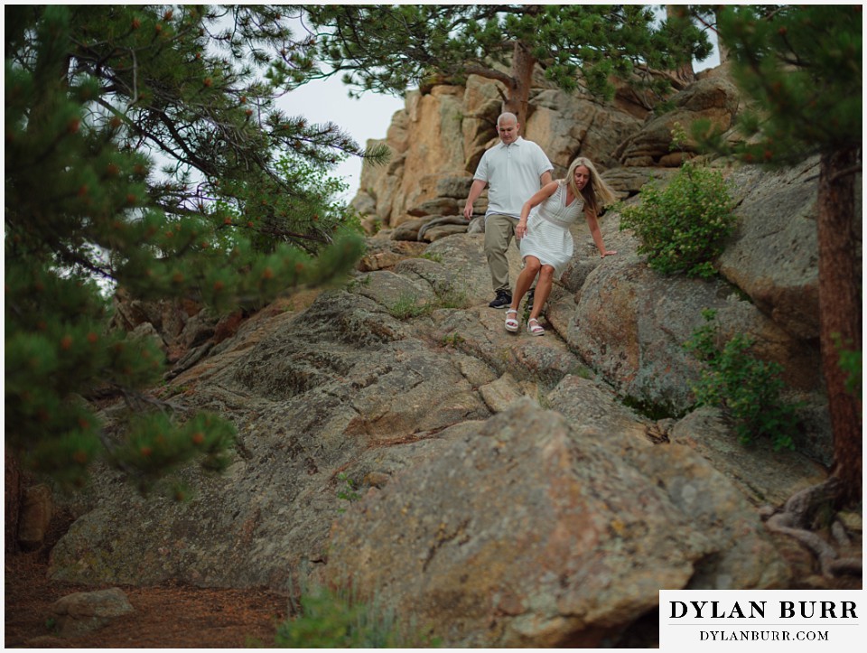 couple hiking together during spring engagement photo session