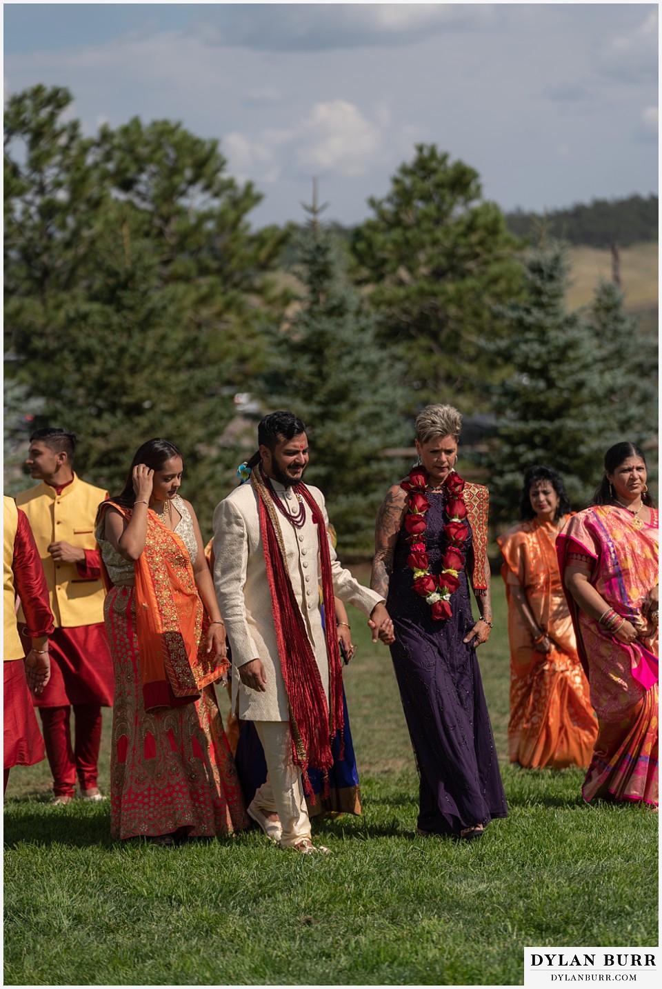 spruce mountain ranch wedding indian wedding groom and brides mother walking towards mandap