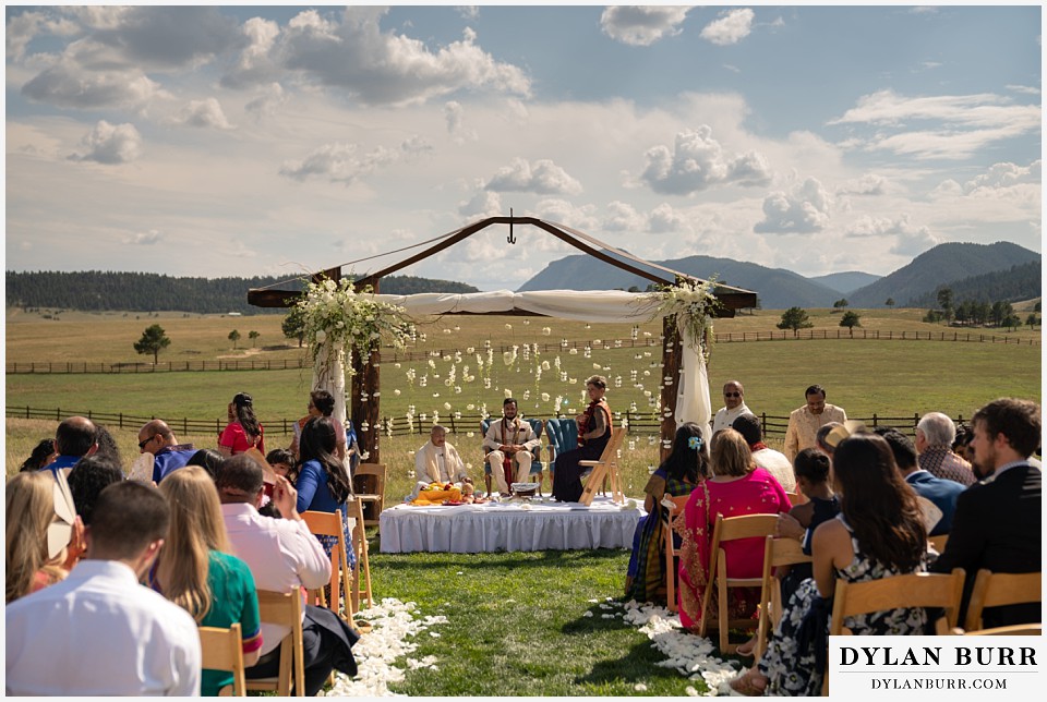 spruce mountain ranch wedding indian wedding groom and brides mom under mandap