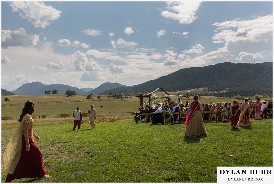 spruce mountain ranch wedding indian wedding bridesmaids enter wedding ceremony