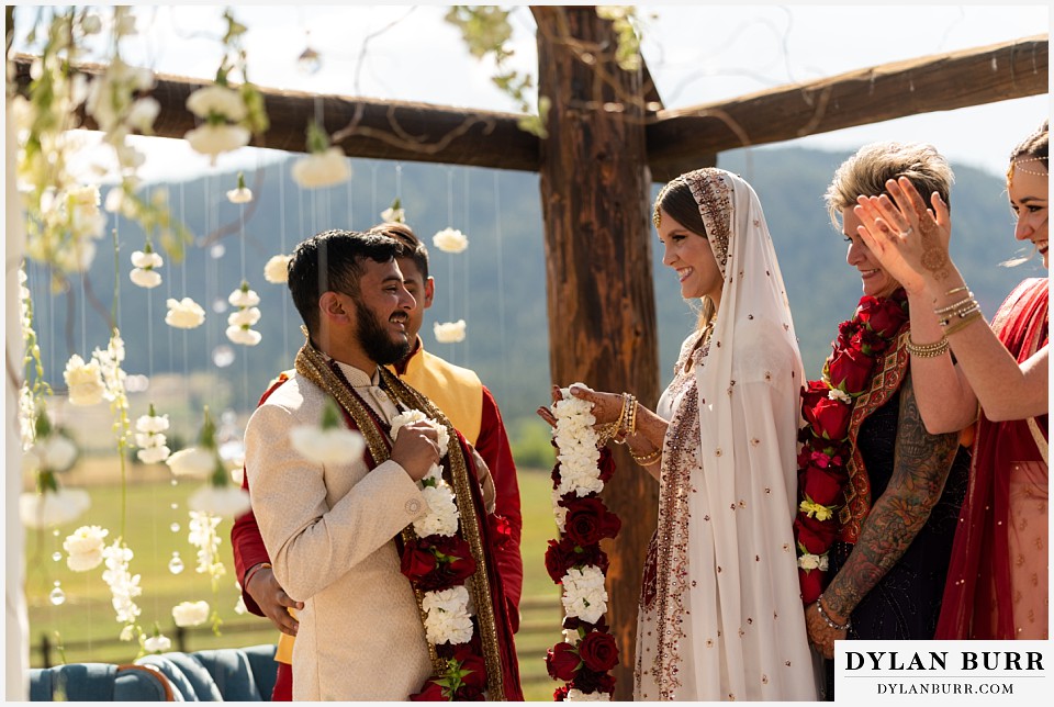 spruce mountain ranch wedding indian wedding bride and groom exchange garlands jai mala