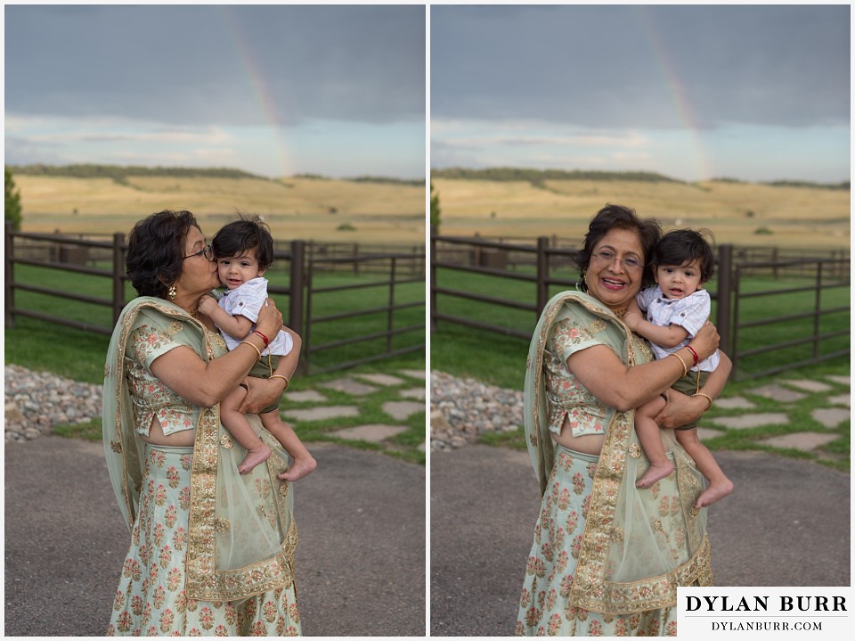 spruce mountain ranch wedding indian wedding grooms mother with grandson and rainbow in the background
