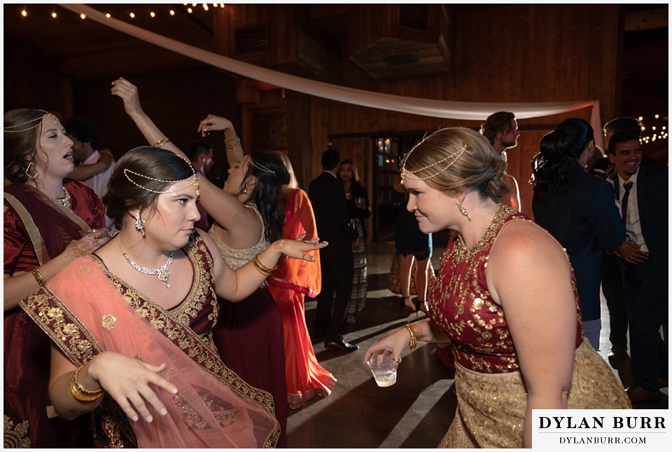 spruce mountain ranch wedding indian wedding bridesmaids showing off dance moves