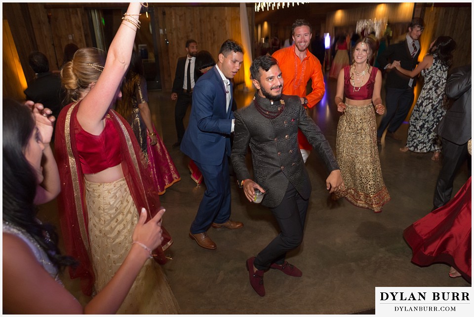 spruce mountain ranch wedding indian wedding groom at reception partying