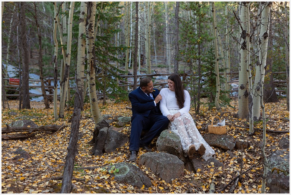 staunton state park colorado elopement wedding sitting in aspen leaves
