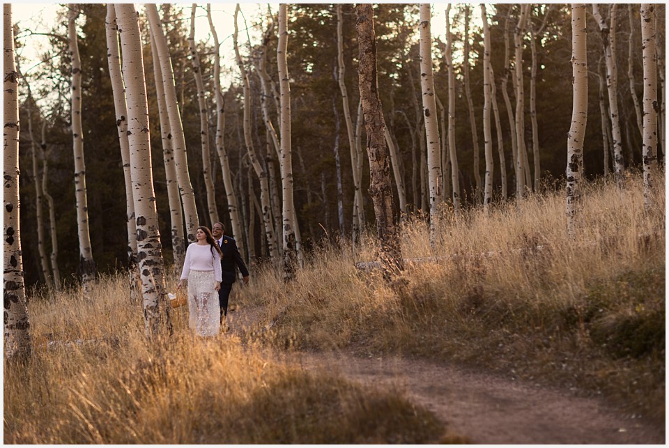 staunton state park colorado elopement wedding together at sunset walking in aspen trees