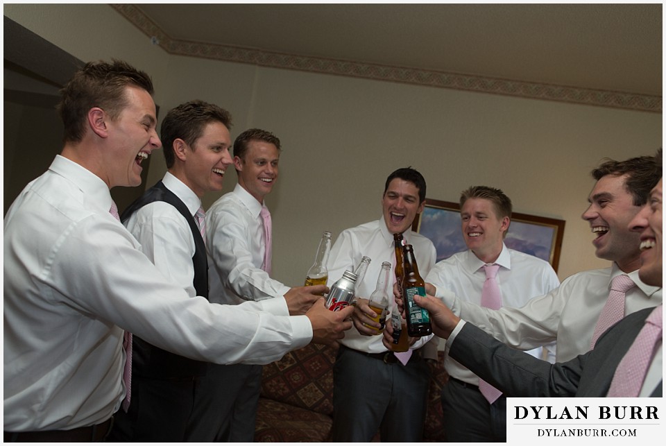 steamboat mountain weddings colorado groom and groomsmen toasting each other