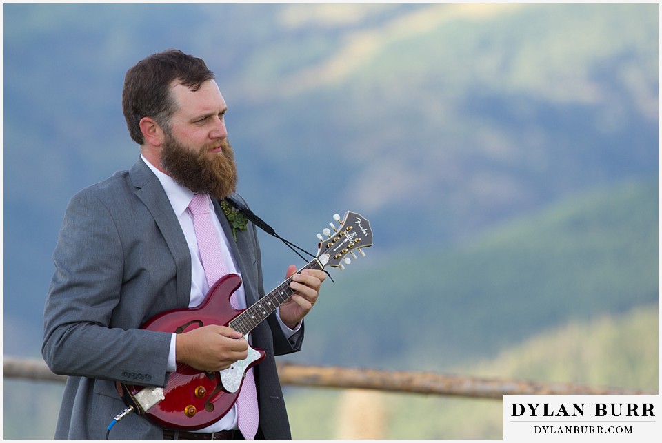 steamboat mountain weddings colorado brother playing mandolyn
