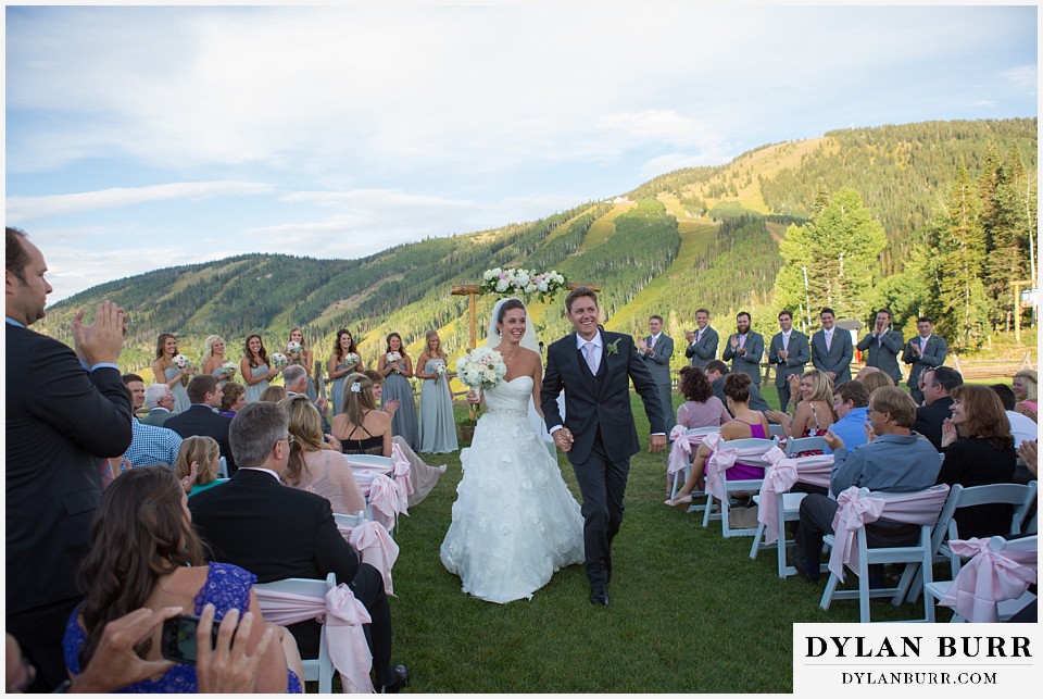 steamboat mountain weddings colorado bride and groom leaving ceremony together