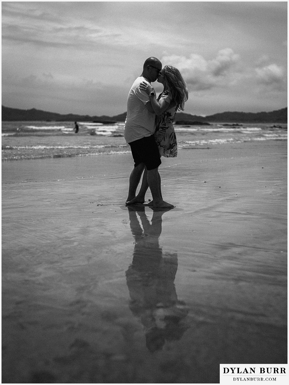 tamarindo beach costa rica photo session couple kissing black and white on beach